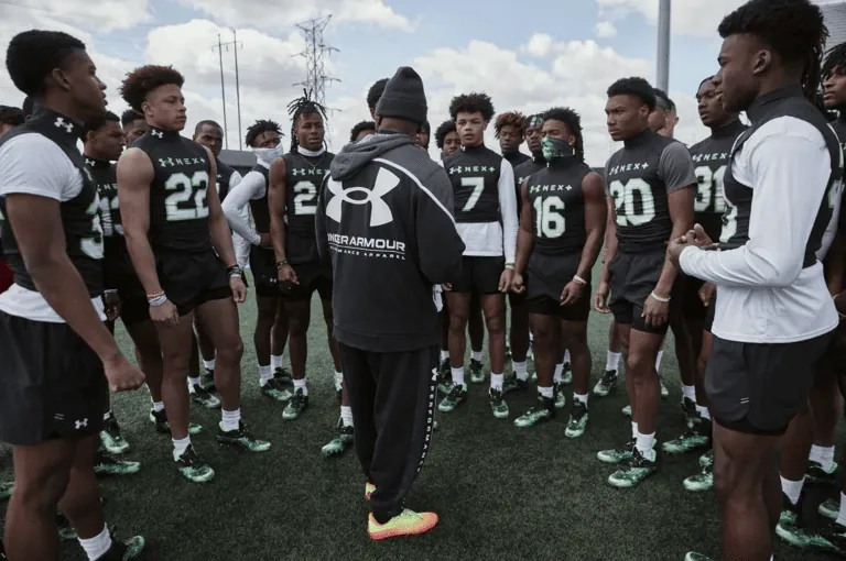 Team huddle around during a combine.