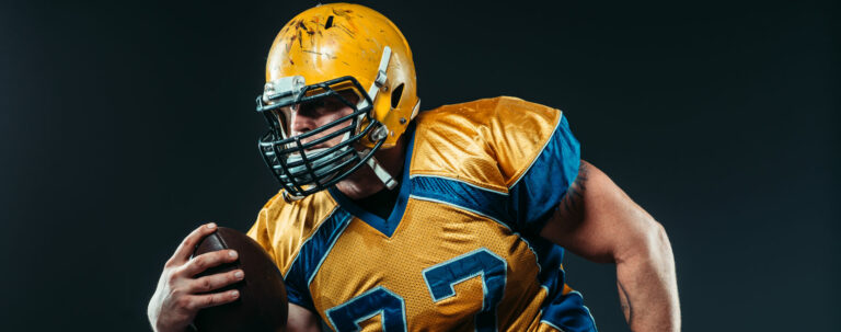 Football player posing.