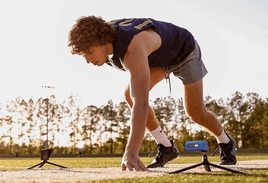 Soccer player about to sprint.