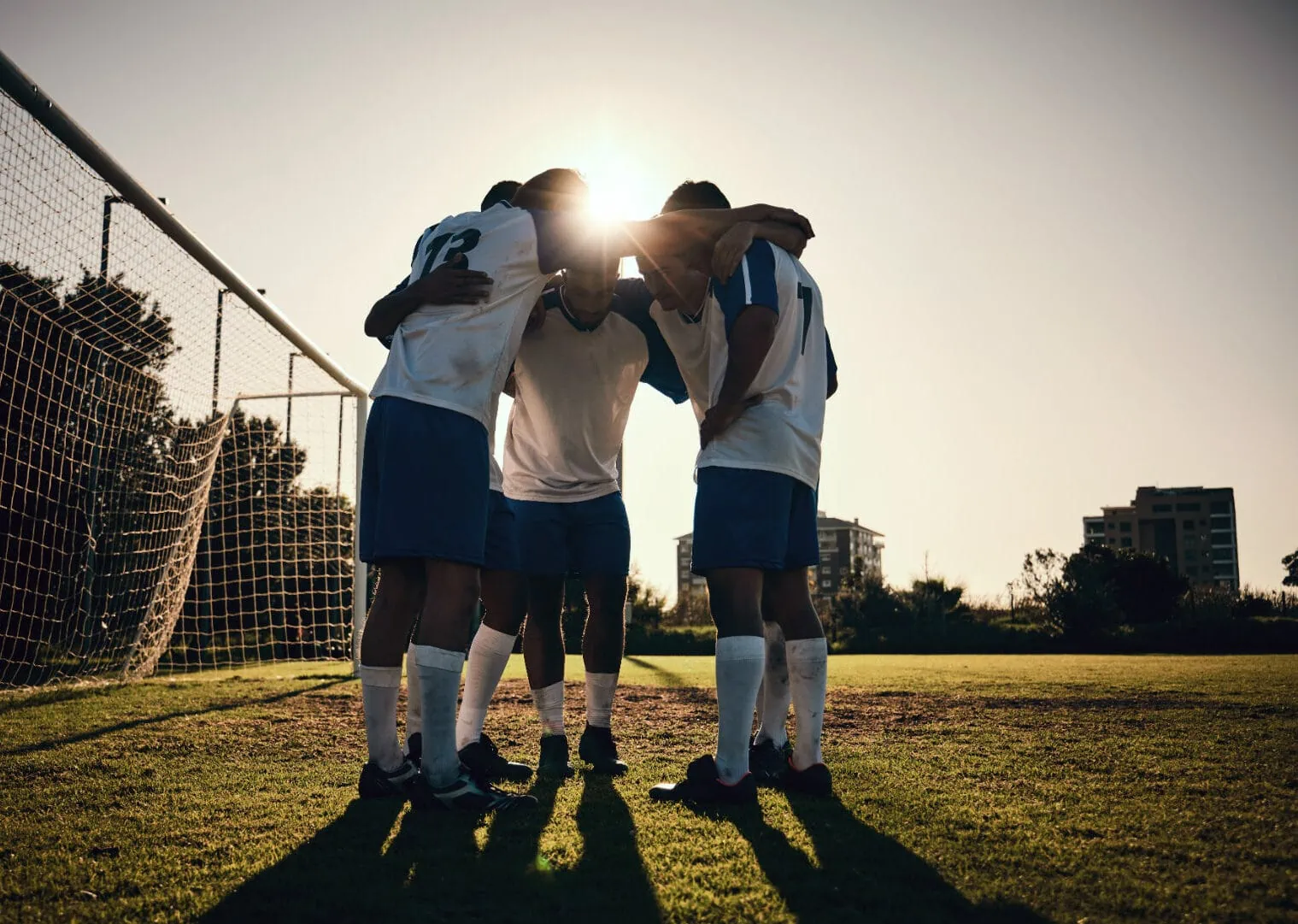 Soccer team huddle.